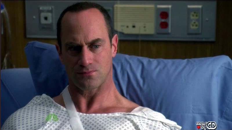 Closeup of ripped stabler in gown and sling
